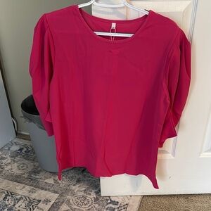 Pink and blue women’s dress shirts with half puffer sleeves